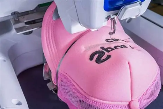 Sewing machine stitching a curved hat seam