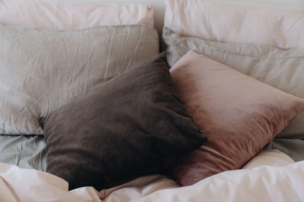 Patterned pillowcase on a made bed
