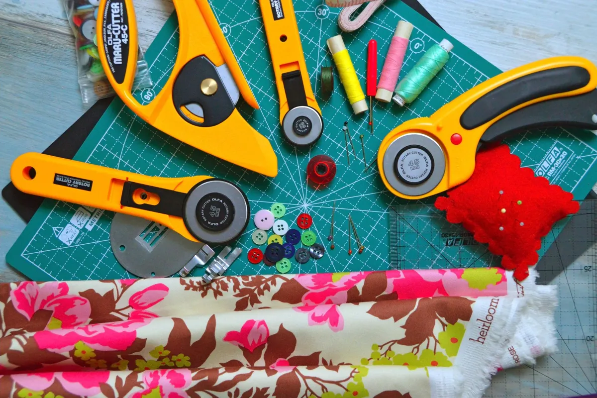 Rotary cutter, ruler and fabric on a cutting mat